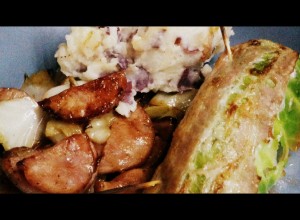 New Year's cabbage rolls, sauteed cabbage with kielbasa and onions, and served with rustic red potato mash