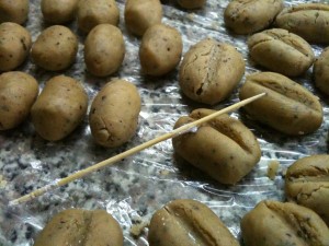 The trick is to make a centre crease with the skewer, and then push down on both sides tapering inwards as you go till you reach the middle of the crease. That opens the crease up and emulates the split bean look perfectly.
